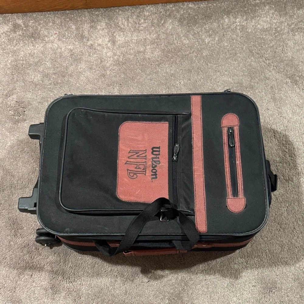 Wilson Black Football Roller Suitcase
